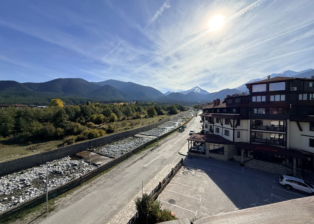 View along the Glazne river to Todorka peak from a Downtown Bansko apartment
