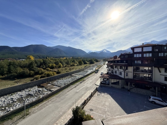 View along the Glazne river to Todorka peak from a Downtown Bansko apartment