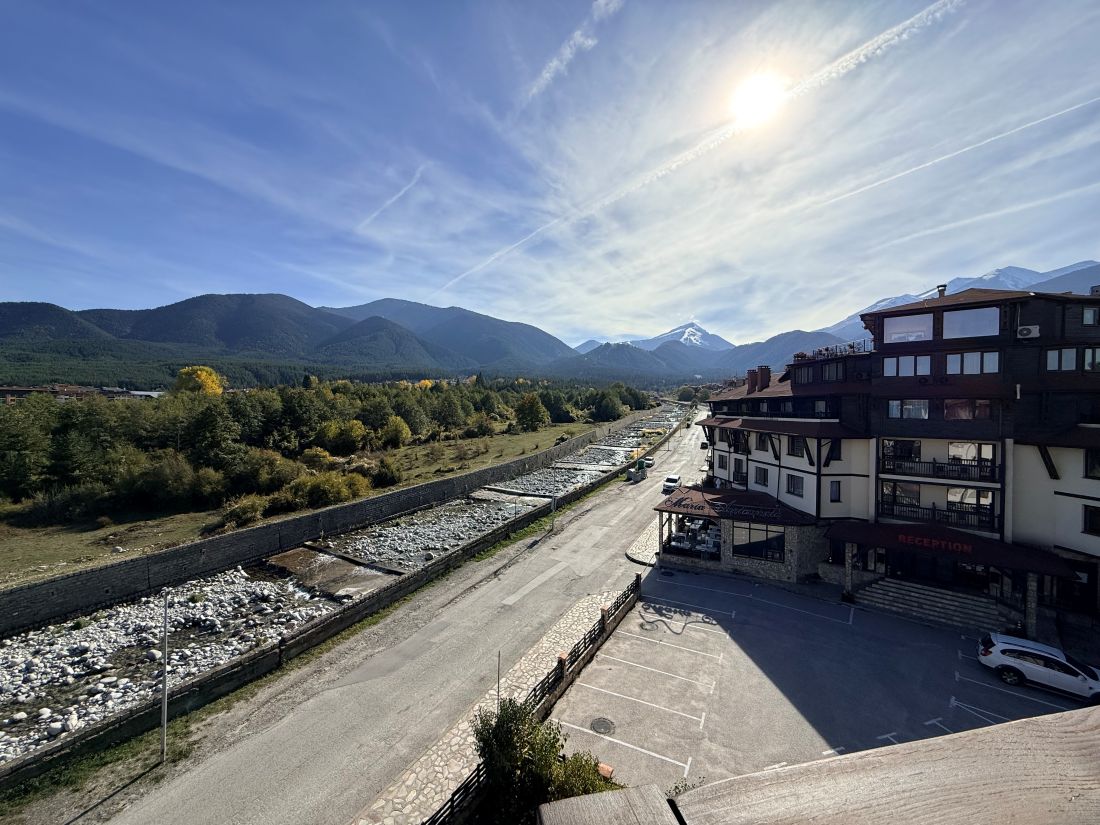 View along the Glazne river to Todorka peak from a Downtown Bansko apartment