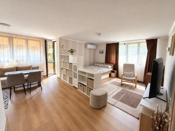 Living and dining area with wood-effect floor and stone-effect kitchen wall, Park Lane Bansko