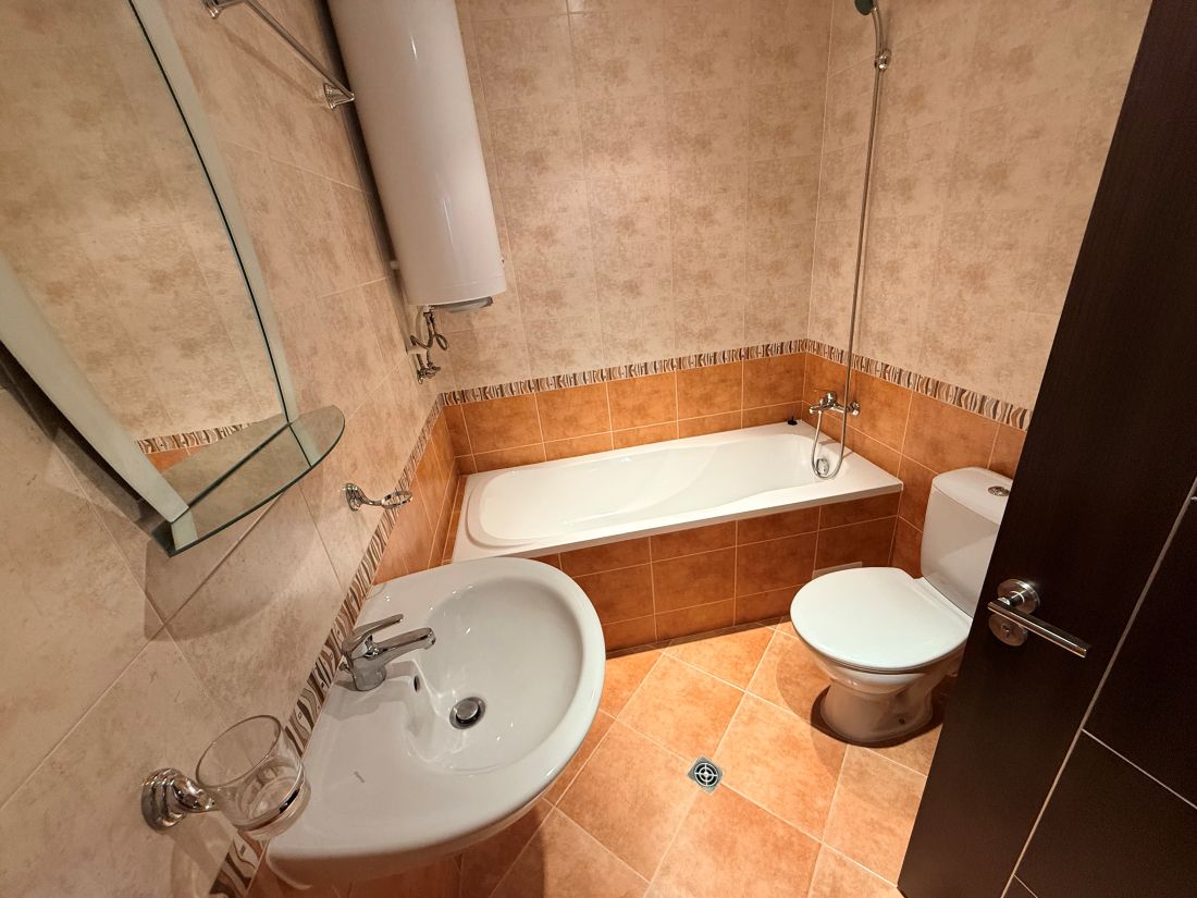 Alpine Lodge Bansko apartment bedroom with double bed and wardrobe