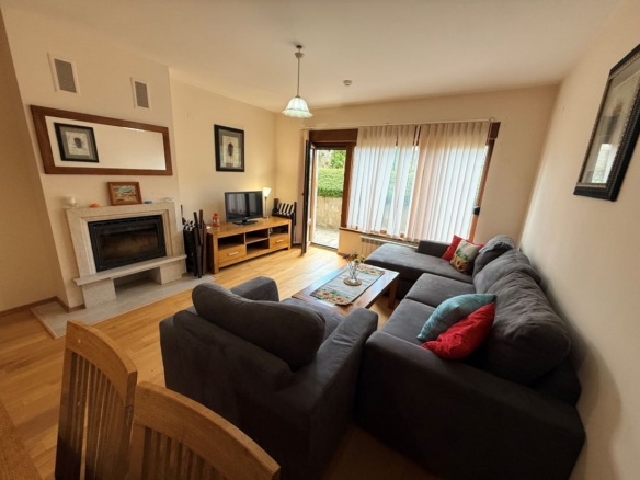 Pirin Lodge Bansko two-bedroom apartment, living room with terrace door